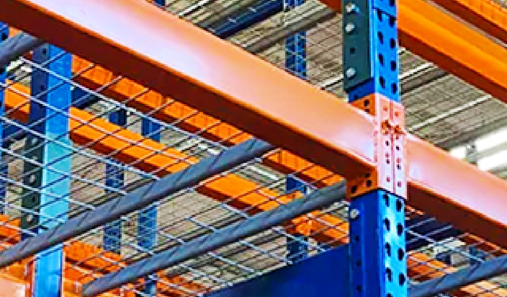 Close-up view of industrial warehouse shelving with orange beams, metal supports, and wire mesh deck, viewed from below—ideal for Double-Deep Rack storage solutions.